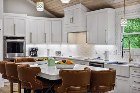 Full kitchen with all cooking essentials and island for additional seating (This is one of two kitchens in the home!)