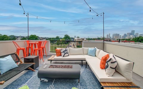 Unwind under the stars on our rooftop patio featuring cozy lounge seating