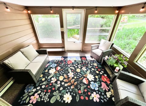 The screen porch is the place to sit and enjoy the outdoors without mosquitos!
