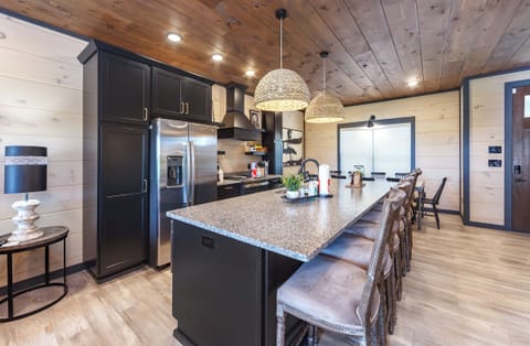 Kitchen with large island and multiple bar stools