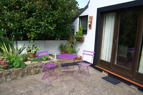 Patio at Carni Lodge with small table and two chairs