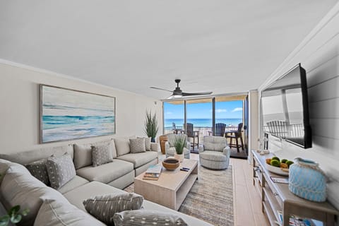 Your oceanfront sanctuary awaits with floor-to-ceiling windows framing endless blue waters, plush seating, and a private balcony for morning coffee moments.