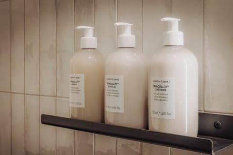 Shower, rainfall showerhead, designer toiletries, hair dryer