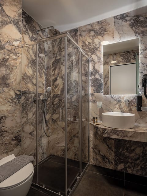 Superior Triple Room | Bathroom | Hair dryer, slippers