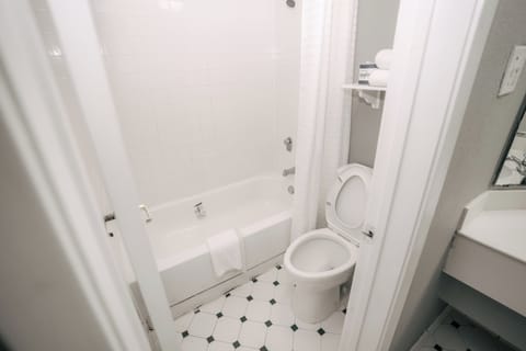 Comfort Room, 1 King Bed | Bathroom | Bathtub, hair dryer, towels, soap