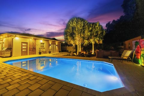 Heated saltwater pool surrounded by palms and privacy - take a dip, stay awhile.