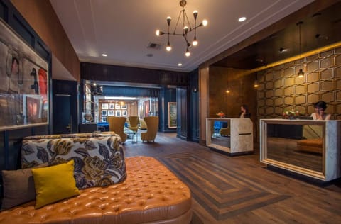 Our lobby blends rustic charm with upscale design, featuring stone walls and rich wooden floors, providing a cozy retreat from the bustling city.