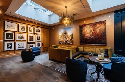 Our lobby features an eclectic mix of classic furnishings, bold artwork, and modern comfort, perfect for both relaxation and inspiration.