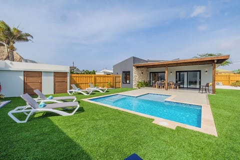 Enjoy the ultimate relaxation experience in your private pool surrounded by lush greenery. Stretch out on our luxurious sun loungers, bask in the warm sunlight, and let your worries melt away.