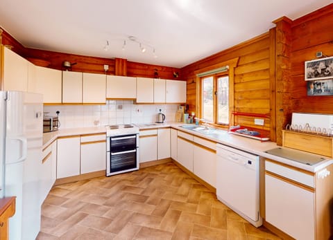 Kitchen with dishwasher and electric oven