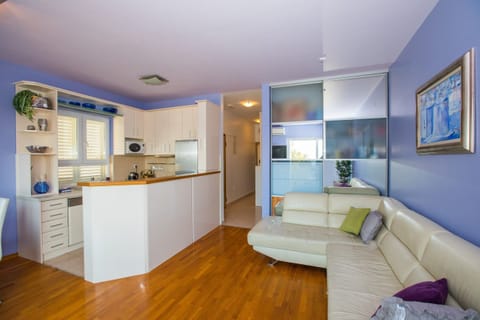 Apartment (Two Bedroom Apartment with Balcony an) | Living room | 32-inch flat-screen TV with digital channels