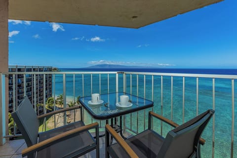 Step onto your private balcony and savor your morning coffee with an uninterrupted ocean view. The turquoise waters and distant island silhouette create a serene escape where you can truly unwind.