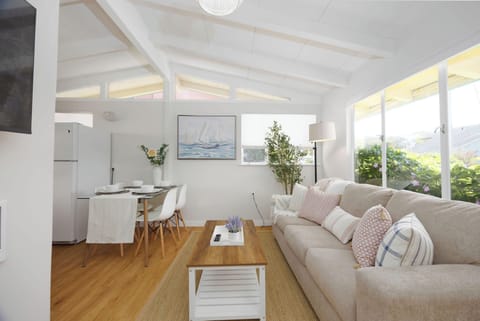 Cozy sofa in the living room with abundant natural light