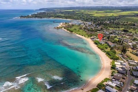 Crystal-blue bay seen from above, perfect for sunny beach days.
