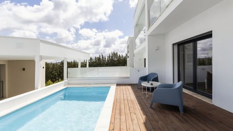 Lovely outdoor pool with seating area for great moments in the sun. #Pool #Lovely
