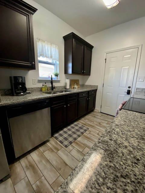One view of the Kitchen which is well stocked with dinnerware and cookware.  Has a drip coffee pot.