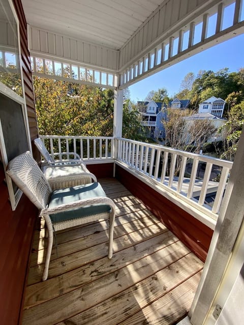 Balcony off the master suite with views of pool and lake. 