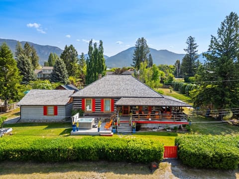 Exterior view of the Barracks and its impeccable yard space for kids & pets to frolic.