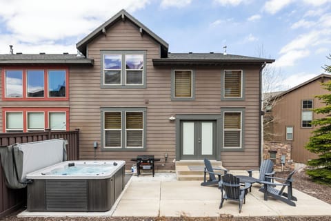 - Step outside to a private patio with hot tub and grill  
- Comfortable Adirondack chairs surround a fire-ready space  
- Relax outdoors after exploring with your group