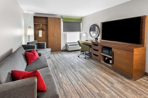 Studio Suite | Living area | 50-inch flat-screen TV with cable channels, TV, pay movies
