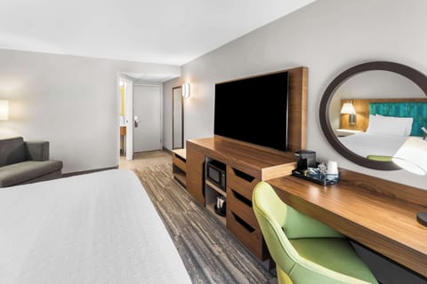 Hypo-allergenic bedding, desk, laptop workspace, blackout drapes