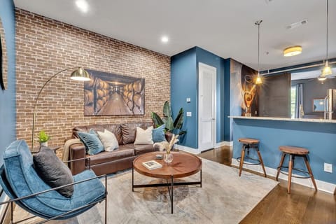 Step into a stylish and cozy living room where industrial charm meets modern sophistication.