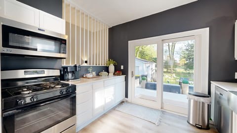 Large patio back door slides open to the backyard