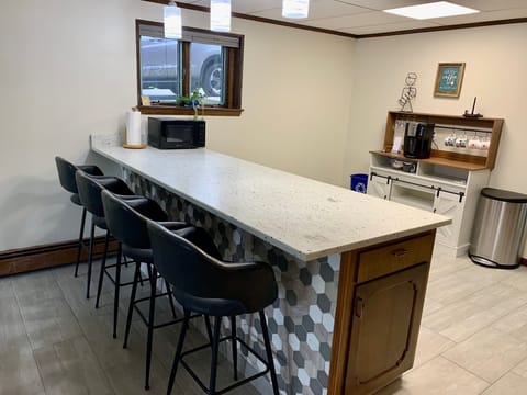 Bar seating between kitchen and main living area.