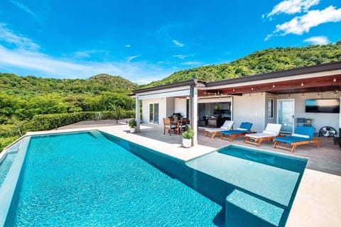 Enjoy breathtaking sunsets from the poolside BBQ area with stunning views