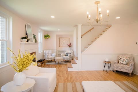 Relax in a sunlit living room featuring elegant furnishings and cozy comforts.