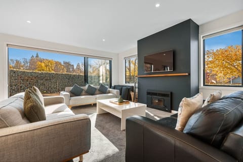 Living area with sofas, fireplace and smart tv