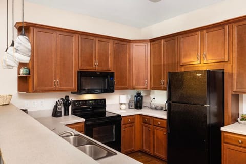 The sleek, fully equipped kitchen is ready for any meal – from quick bites to full family dinners.