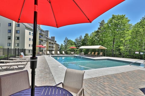 Sunny days are made for a swim, with plenty of room around the pool to settle into a lounge chair.