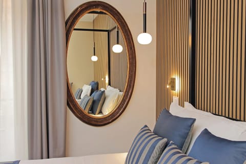 Deluxe Triple Room, City View | Free minibar items, in-room safe, desk, laptop workspace