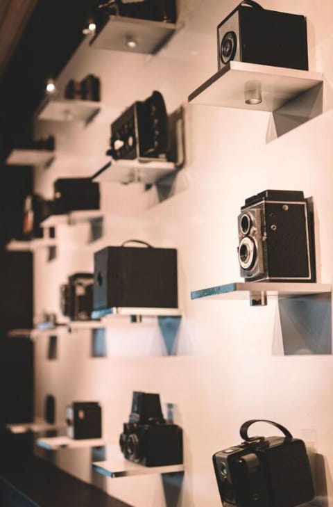 Our permanent collection display, showcasing a variety of unique camera equipment.