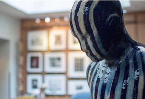 A captivating sculpture from our in-house art collection, enhancing the cultural ambiance.