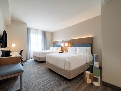 Desk, blackout drapes, iron/ironing board, bed sheets