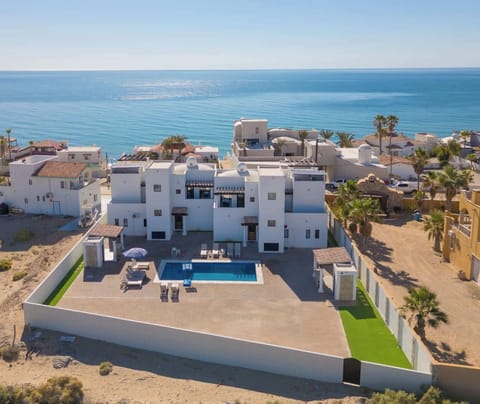 2 Houses 1 Relaxed stay Only steps from the beach.