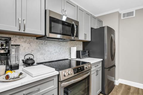 Fully equipped kitchen: Prepare delicious meals at your convenience. Features electric oven and stove, toaster oven, stainless steel appliances and dual- brew coffee maker.
