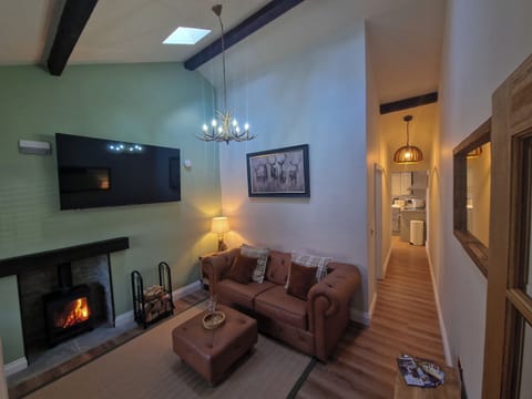 Cottage | Living area | TV, fireplace