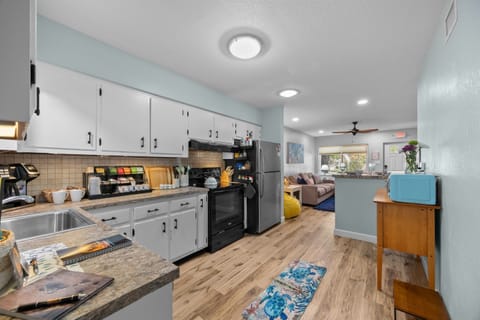 Kitchen Delight: Modern appliances and vibrant colors make meal prep a breeze in this inviting space!