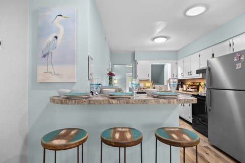 Kitchen Paradise: Bright, beachy vibes with modern appliances and stylish bar seating!