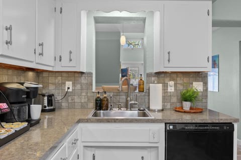 Kitchen Delight: Bright, modern space with sleek appliances and a vibrant coastal vibe!