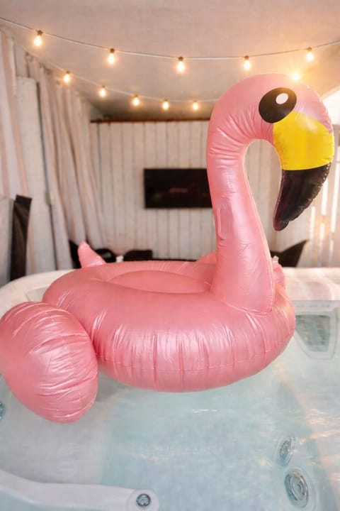 Enjoy YOUR private hot tub retreat, complete with a cozy seating area & Smart TV