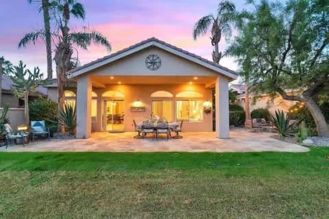 Everything you need for outdoor living awaits—fire pit, BBQ, covered patio, and outdoor dining.