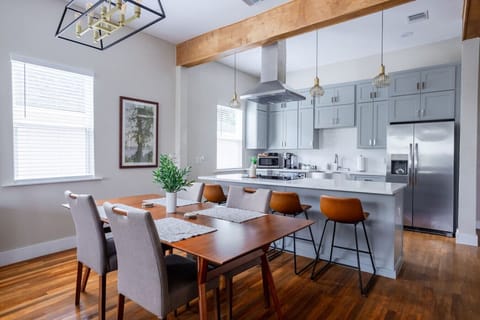 Bright, modern chef’s kitchen with West Elm dining and a stunning open layout — perfect for gathering.