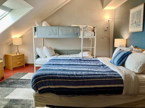 Cozy stay with a queen bed & twin bunk beds, perfect for families or small groups!