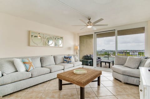 Living room with comfortable seating and Old River views at Wind Drift Orange Beach vacation condo