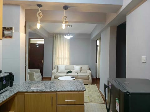 Comfort Apartment | Living area | 24-inch Smart TV with digital channels