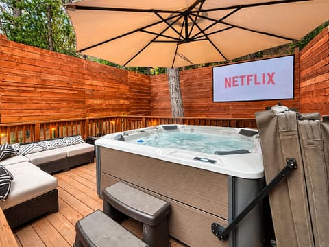 Hot tub under stars, watch a movie on a 100" outdoor projector.